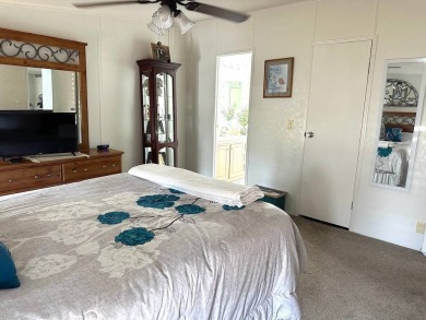 THIS 2-BEDROOM, 2-BATHROOM HOME HAS BEEN BEAUTIFULLY UPDATED AND on Anglers Green Golf Course in Florida - for sale on GolfHomes.com, golf home, golf lot