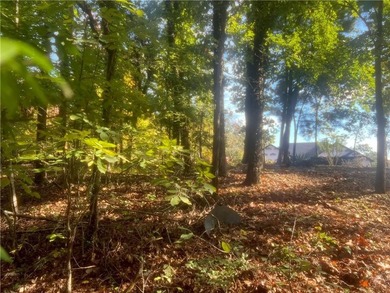 Discover the perfect blend of privacy and convenience on this on Bella Vista - Metfield Golf Complex and Country Club in Arkansas - for sale on GolfHomes.com, golf home, golf lot