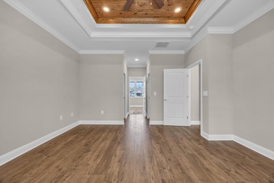 This brand-new, all-brick beauty delivers standout design on Long Bay Club in South Carolina - for sale on GolfHomes.com, golf home, golf lot