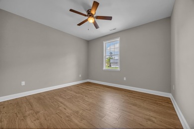 This brand-new, all-brick beauty delivers standout design on Long Bay Club in South Carolina - for sale on GolfHomes.com, golf home, golf lot