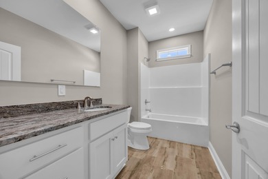 This brand-new, all-brick beauty delivers standout design on Long Bay Club in South Carolina - for sale on GolfHomes.com, golf home, golf lot