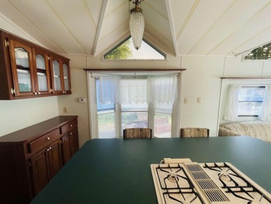 Look no further! This cute manufactured home in Christmas on Christmas Mountain Village Golf Course in Wisconsin - for sale on GolfHomes.com, golf home, golf lot