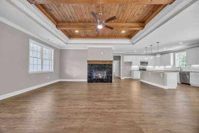 This brand-new, all-brick beauty delivers standout design on Long Bay Club in South Carolina - for sale on GolfHomes.com, golf home, golf lot