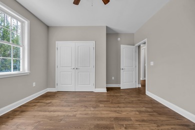 This brand-new, all-brick beauty delivers standout design on Long Bay Club in South Carolina - for sale on GolfHomes.com, golf home, golf lot