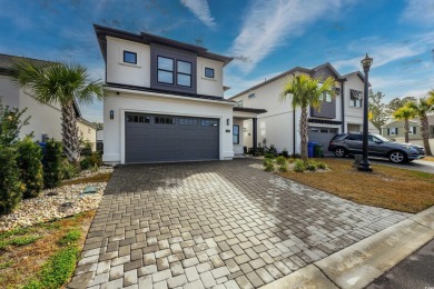 Nestled in a serene gated community with breathtaking views of a on Cane Patch Driving Range in South Carolina - for sale on GolfHomes.com, golf home, golf lot