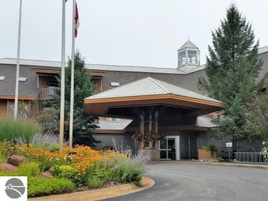 This second-floor Lodge suite offers picturesque views of both on Cedar River Golf Course in Michigan - for sale on GolfHomes.com, golf home, golf lot