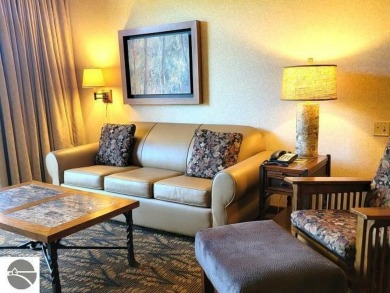 This second-floor Lodge suite offers picturesque views of both on Cedar River Golf Course in Michigan - for sale on GolfHomes.com, golf home, golf lot