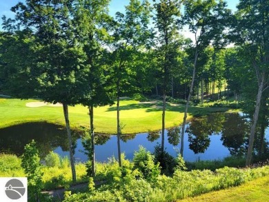 This second-floor Lodge suite offers picturesque views of both on Cedar River Golf Course in Michigan - for sale on GolfHomes.com, golf home, golf lot