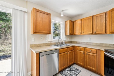 Welcome to this well maintained three bedroom, two bath townhome on Golf Club At Fleming Island in Florida - for sale on GolfHomes.com, golf home, golf lot