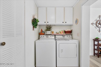This sweet coastal cottage is move in ready. Sit on the screened on Sea Trail Golf Resort in North Carolina - for sale on GolfHomes.com, golf home, golf lot