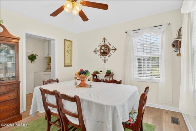 This sweet coastal cottage is move in ready. Sit on the screened on Sea Trail Golf Resort in North Carolina - for sale on GolfHomes.com, golf home, golf lot
