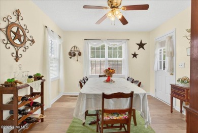 This sweet coastal cottage is move in ready. Sit on the screened on Sea Trail Golf Resort in North Carolina - for sale on GolfHomes.com, golf home, golf lot