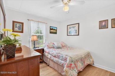 This sweet coastal cottage is move in ready. Sit on the screened on Sea Trail Golf Resort in North Carolina - for sale on GolfHomes.com, golf home, golf lot