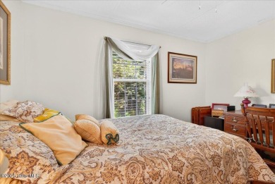 This sweet coastal cottage is move in ready. Sit on the screened on Sea Trail Golf Resort in North Carolina - for sale on GolfHomes.com, golf home, golf lot