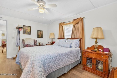 This sweet coastal cottage is move in ready. Sit on the screened on Sea Trail Golf Resort in North Carolina - for sale on GolfHomes.com, golf home, golf lot