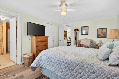 This sweet coastal cottage is move in ready. Sit on the screened on Sea Trail Golf Resort in North Carolina - for sale on GolfHomes.com, golf home, golf lot