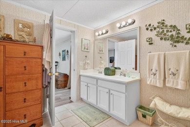 This sweet coastal cottage is move in ready. Sit on the screened on Sea Trail Golf Resort in North Carolina - for sale on GolfHomes.com, golf home, golf lot