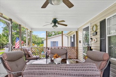 This sweet coastal cottage is move in ready. Sit on the screened on Sea Trail Golf Resort in North Carolina - for sale on GolfHomes.com, golf home, golf lot