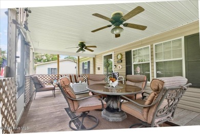 This sweet coastal cottage is move in ready. Sit on the screened on Sea Trail Golf Resort in North Carolina - for sale on GolfHomes.com, golf home, golf lot