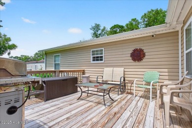 This sweet coastal cottage is move in ready. Sit on the screened on Sea Trail Golf Resort in North Carolina - for sale on GolfHomes.com, golf home, golf lot