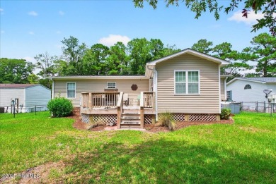 This sweet coastal cottage is move in ready. Sit on the screened on Sea Trail Golf Resort in North Carolina - for sale on GolfHomes.com, golf home, golf lot