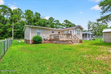 This sweet coastal cottage is move in ready. Sit on the screened on Sea Trail Golf Resort in North Carolina - for sale on GolfHomes.com, golf home, golf lot