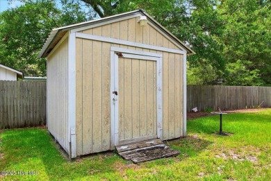 This sweet coastal cottage is move in ready. Sit on the screened on Sea Trail Golf Resort in North Carolina - for sale on GolfHomes.com, golf home, golf lot