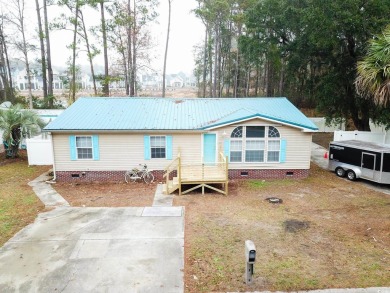 Welcome to 320 Misty Breeze Ln, a charming 3-bedroom, 2-bathroom on Tupelo Bay Golf Complex  in South Carolina - for sale on GolfHomes.com, golf home, golf lot