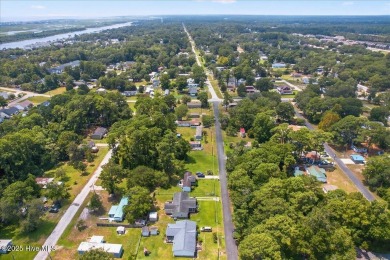 This sweet coastal cottage is move in ready. Sit on the screened on Sea Trail Golf Resort in North Carolina - for sale on GolfHomes.com, golf home, golf lot