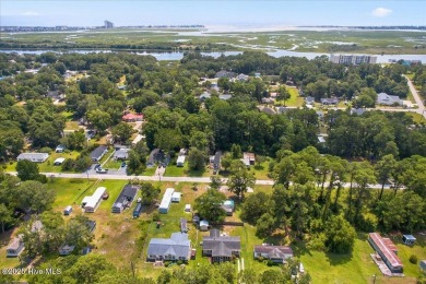 This sweet coastal cottage is move in ready. Sit on the screened on Sea Trail Golf Resort in North Carolina - for sale on GolfHomes.com, golf home, golf lot