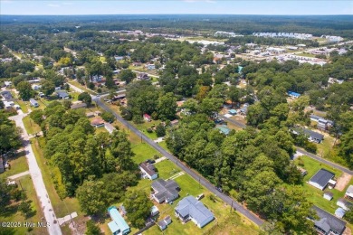 This sweet coastal cottage is move in ready. Sit on the screened on Sea Trail Golf Resort in North Carolina - for sale on GolfHomes.com, golf home, golf lot
