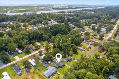 This sweet coastal cottage is move in ready. Sit on the screened on Sea Trail Golf Resort in North Carolina - for sale on GolfHomes.com, golf home, golf lot