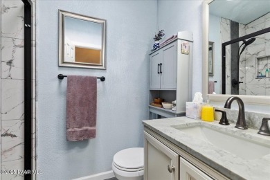This charming and exceptionally well-maintained modular home is on Quail Wood Greens Golf Course in Arizona - for sale on GolfHomes.com, golf home, golf lot