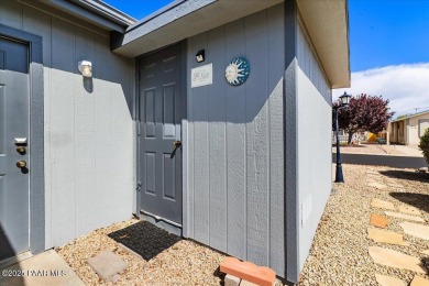 This charming and exceptionally well-maintained modular home is on Quail Wood Greens Golf Course in Arizona - for sale on GolfHomes.com, golf home, golf lot