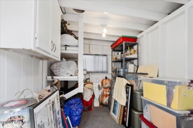 This charming and exceptionally well-maintained modular home is on Quail Wood Greens Golf Course in Arizona - for sale on GolfHomes.com, golf home, golf lot