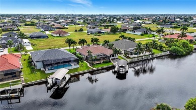 Welcome HOME to this Gulf access pool home that lives large in on Burnt Store Golf Club in Florida - for sale on GolfHomes.com, golf home, golf lot