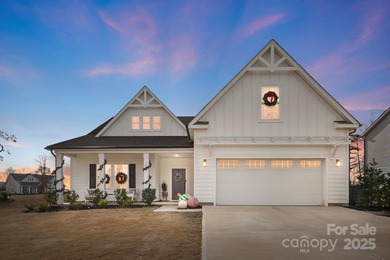 Better than new, this gorgeous home has a welcoming rocking on Stonebridge Golf Club in North Carolina - for sale on GolfHomes.com, golf home, golf lot