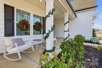 Better than new, this gorgeous home has a welcoming rocking on Stonebridge Golf Club in North Carolina - for sale on GolfHomes.com, golf home, golf lot