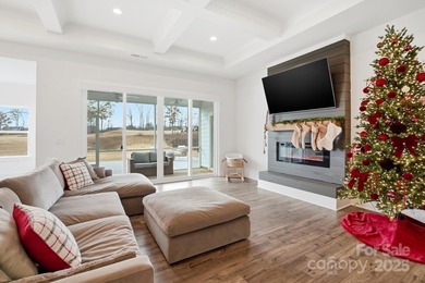 Better than new, this gorgeous home has a welcoming rocking on Stonebridge Golf Club in North Carolina - for sale on GolfHomes.com, golf home, golf lot