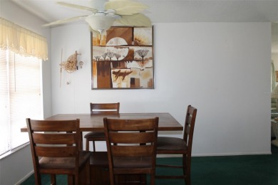 This single-family home, on a corner lot, located in Mainlands on Mainlands Golf Club in Florida - for sale on GolfHomes.com, golf home, golf lot