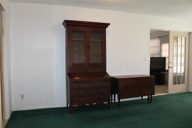 This single-family home, on a corner lot, located in Mainlands on Mainlands Golf Club in Florida - for sale on GolfHomes.com, golf home, golf lot