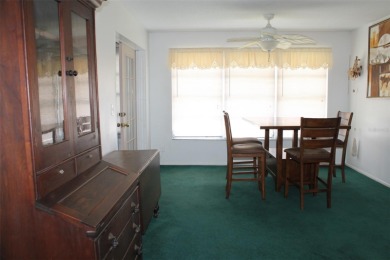 This single-family home, on a corner lot, located in Mainlands on Mainlands Golf Club in Florida - for sale on GolfHomes.com, golf home, golf lot