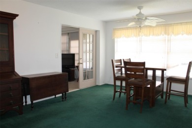 This single-family home, on a corner lot, located in Mainlands on Mainlands Golf Club in Florida - for sale on GolfHomes.com, golf home, golf lot