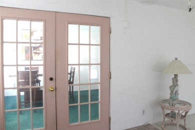 This single-family home, on a corner lot, located in Mainlands on Mainlands Golf Club in Florida - for sale on GolfHomes.com, golf home, golf lot