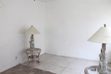 This single-family home, on a corner lot, located in Mainlands on Mainlands Golf Club in Florida - for sale on GolfHomes.com, golf home, golf lot