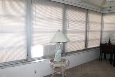 This single-family home, on a corner lot, located in Mainlands on Mainlands Golf Club in Florida - for sale on GolfHomes.com, golf home, golf lot