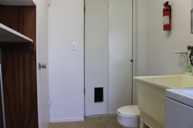 This single-family home, on a corner lot, located in Mainlands on Mainlands Golf Club in Florida - for sale on GolfHomes.com, golf home, golf lot