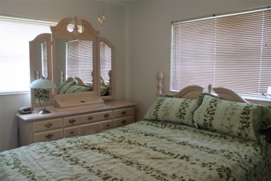 This single-family home, on a corner lot, located in Mainlands on Mainlands Golf Club in Florida - for sale on GolfHomes.com, golf home, golf lot