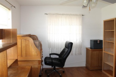 This single-family home, on a corner lot, located in Mainlands on Mainlands Golf Club in Florida - for sale on GolfHomes.com, golf home, golf lot