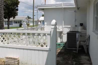 This single-family home, on a corner lot, located in Mainlands on Mainlands Golf Club in Florida - for sale on GolfHomes.com, golf home, golf lot